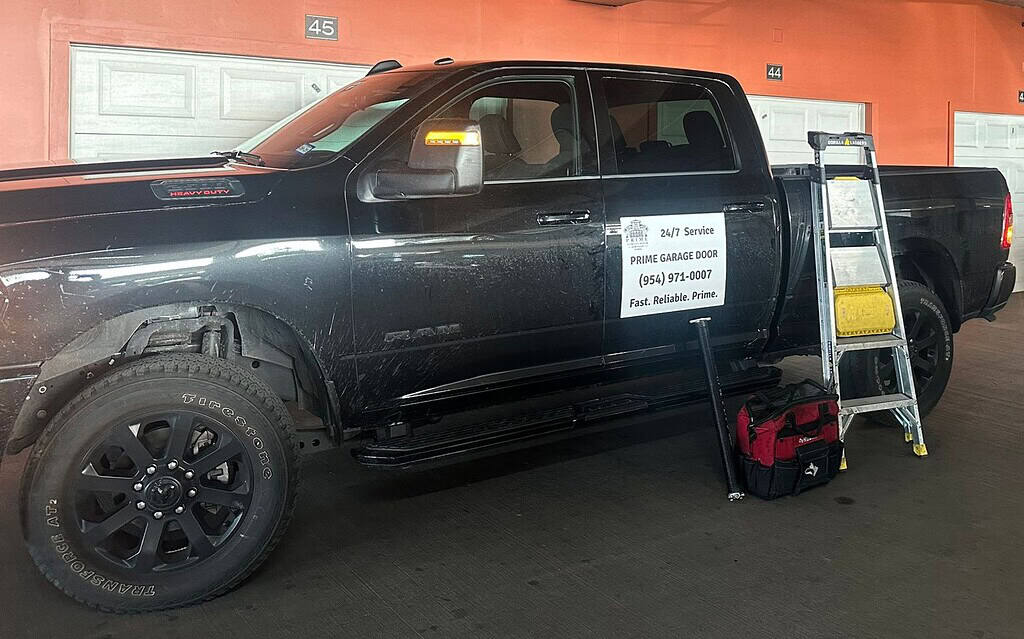 Prime Garage Door Services RAM 2500 truck with branded magnet in South Florida, trusted local garage door company